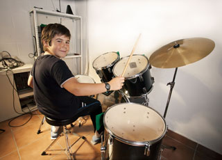 Child practicing drumming