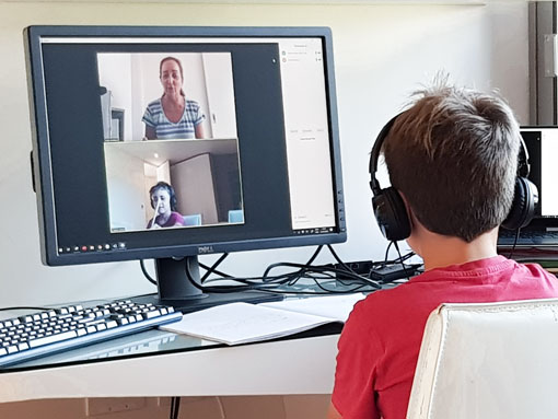Child with an online tutor.
